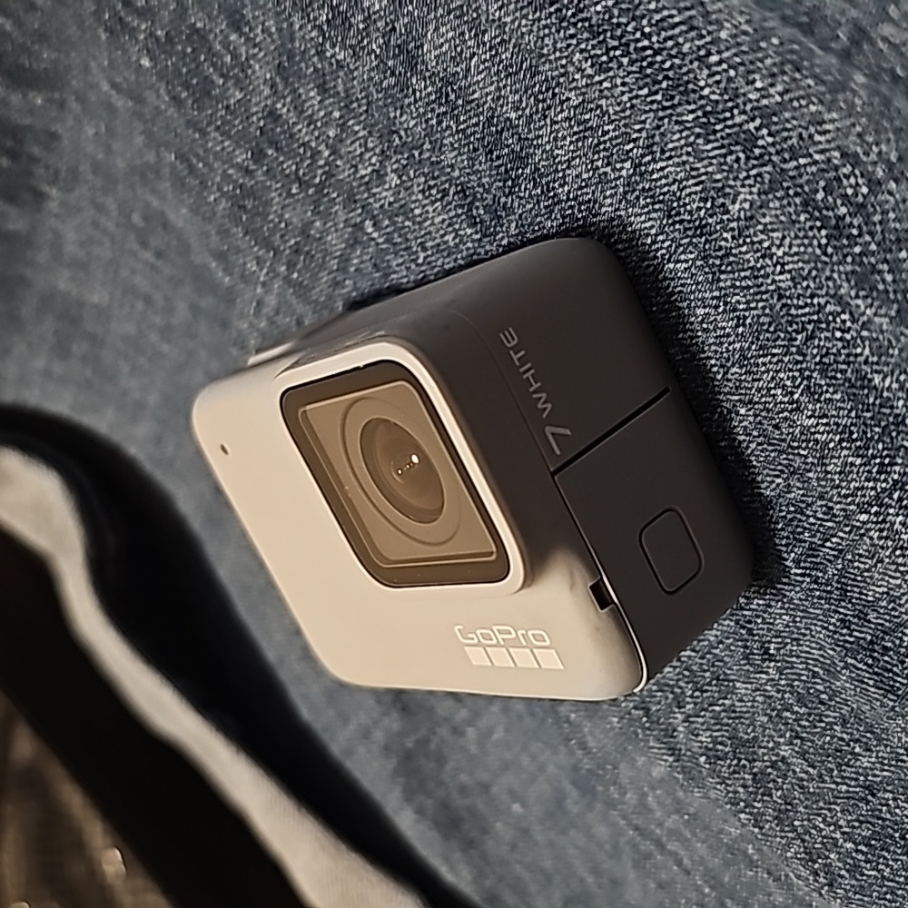 "GoPro Hero 7 White" with 2 (128GB) SD cards, traveling case, and accessories